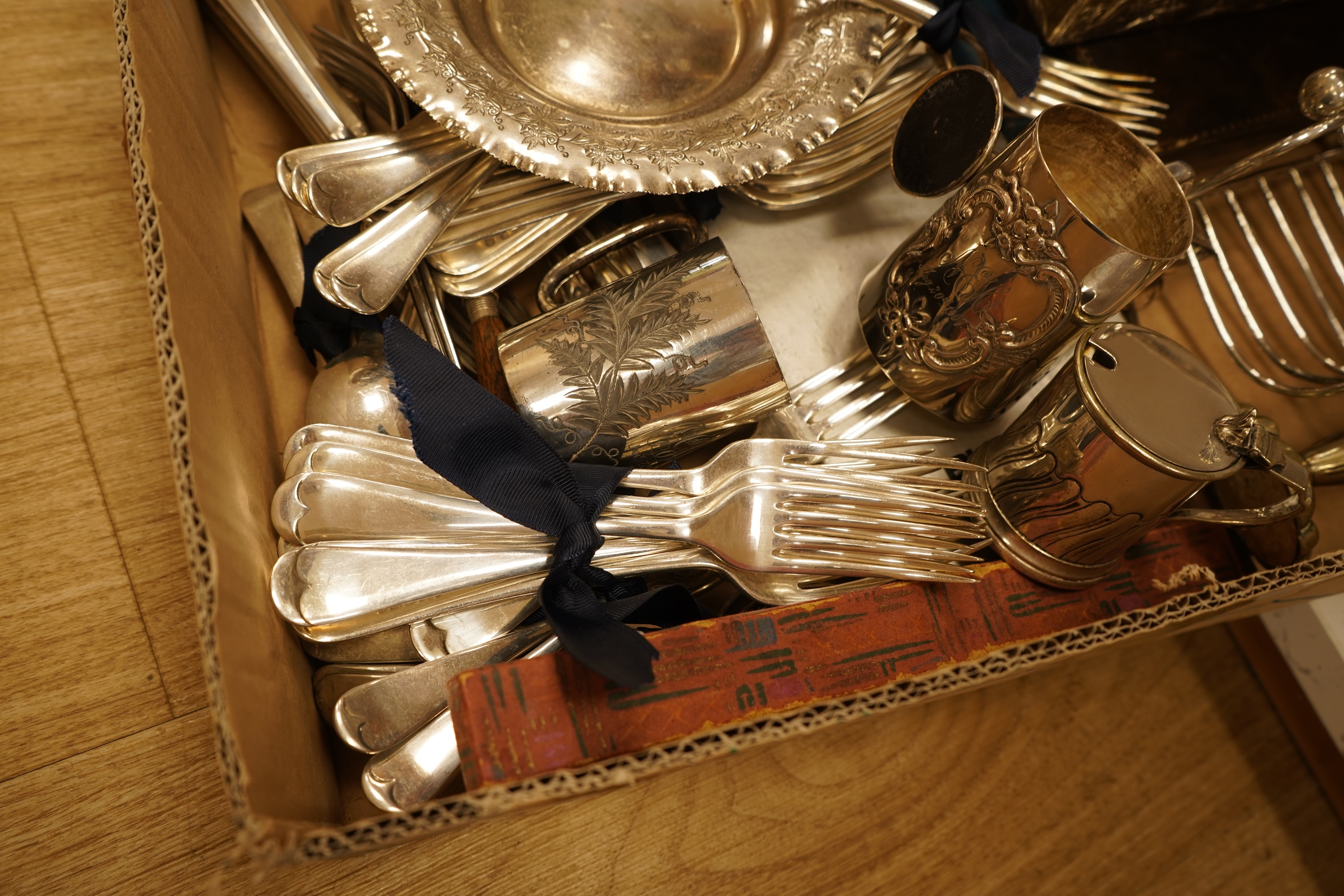 A quantity of assorted plated wares including a pair of 19th century wine coasters, antimony box, toast rack and flatware.